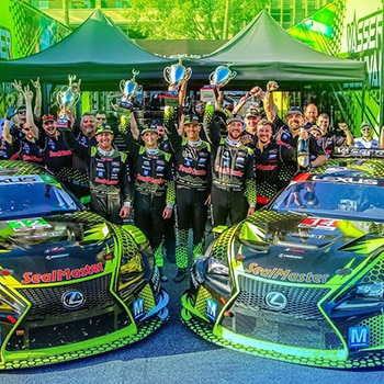 Mouser sponsored Vasser Sullivan Lexus IMSA car and team celebrating Long Beach win